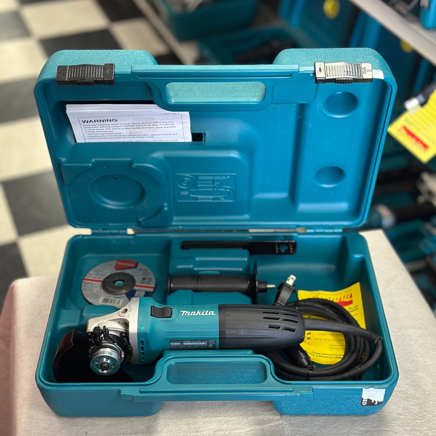 Makita 6 Amp Corded 4 in. Lightweight Angle Grinder with Grinding Wheel, Wheel Guard Side Handle Hard Case