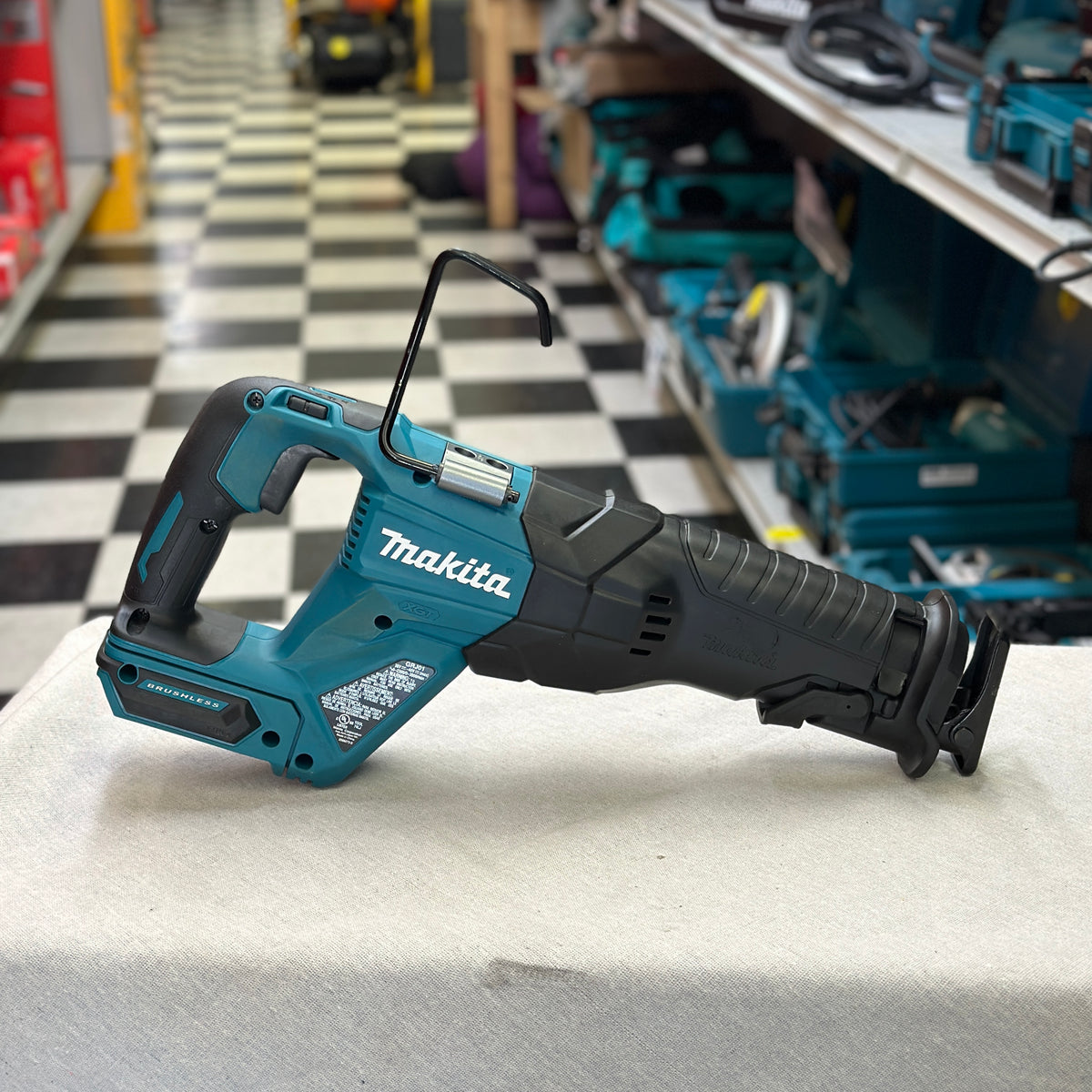Close-up of the blade clamp and front shoe on a Makita GRJ01Z cordless reciprocating saw