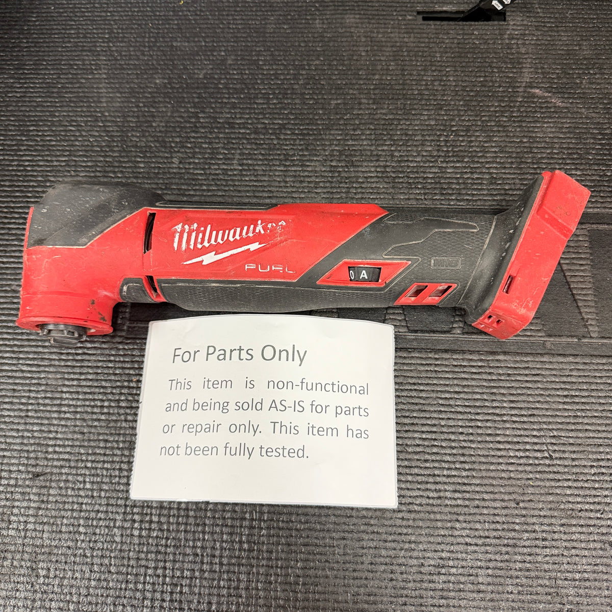 For Parts Only sign with Milwaukee multi-tool